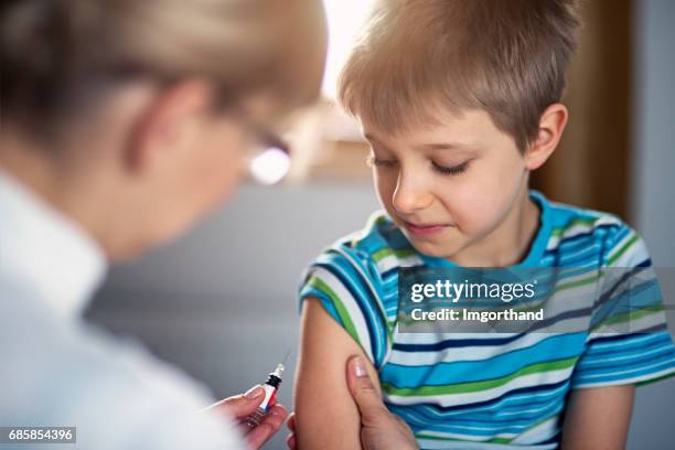 Kid Getting A Injection 3,282 Boy Getting An Injection Stock Photos, High-Res Pictures, and ...