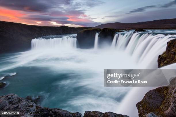 sunrise over godafoss waterfall - impression forte stock pictures, royalty-free photos & images