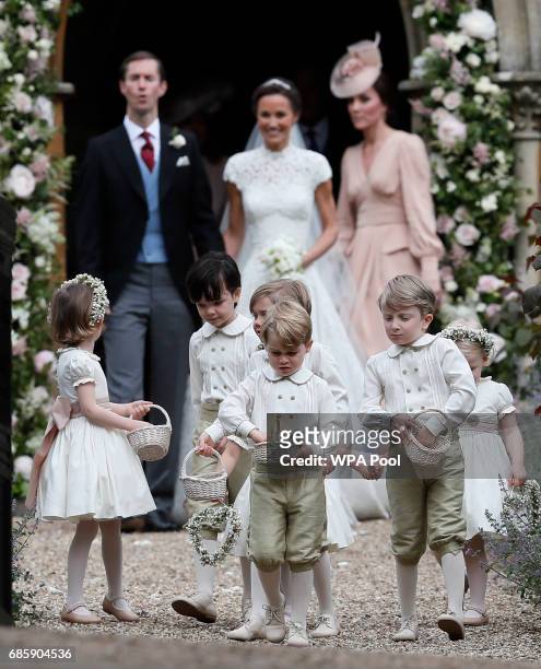 Prince George, center, stands with other flower boys and girls after the wedding of Pippa Middleton and James Matthews at St Mark's Church on May 20,...