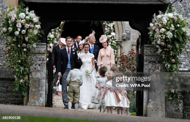 Pippa Middleton and James Matthews smile for the cameras after their wedding at St Mark's Church on May 20, 2017 in Englefield, England.Middleton,...