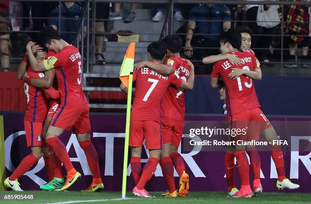 Lim Minhyeok of Korea Republic celebrates with teammates after scoring a goal during the FIFA U-20 World Cup Korea Republic 2017 group A match...