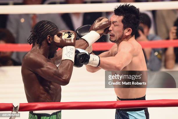 Hassan N'Dam N'Jikam of France punches Ryota Murata of Japan during the WBA World Middleweight title bout between Hassan N'Dam N'Jikam and Ryota...