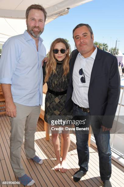 Basil Iwanyk, Elizabeth Olsen and Matthew George attend a lunch hosted by Lexus for The Weinstein Company's "Wind River" stars and director on May...