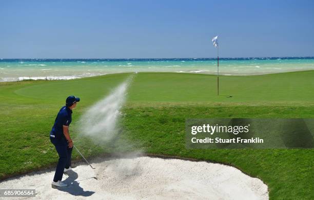 Matteo Manassero of Italy plays from a bunker on the 7th hole during day three of The Rocco Forte Open at Verdura Golf and Spa Resort on May 20, 2017...