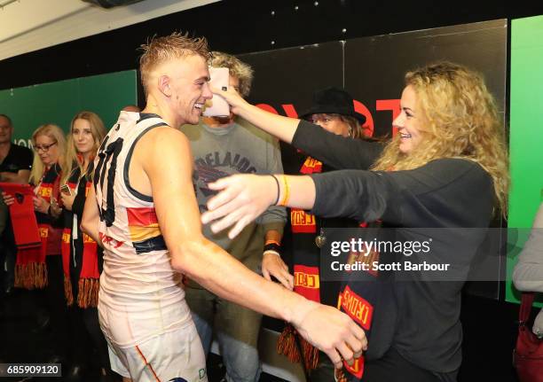Hugh Greenwood of the Crows celebrateswith family members in the rooms after winning the round nine AFL match between the Brisbane Lions and the...