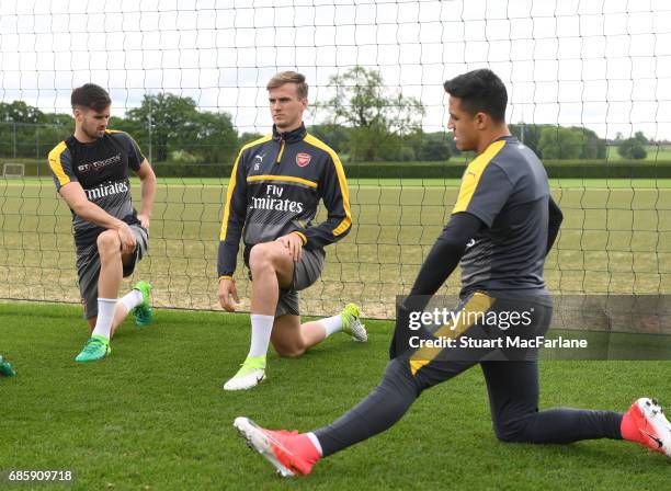 Carl Jenkinson, Rob Holding and Alexis Sanchez of Arsenal during a training session at London Colney on May 20, 2017 in St Albans, England.