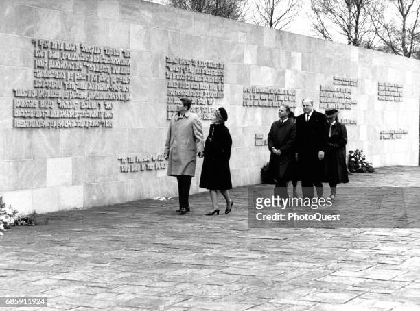 American politician US President Ronald Reagan and US First Lady Nancy Reagan visit a memorial at the site of the Bergen-Belsen concentration camp,...