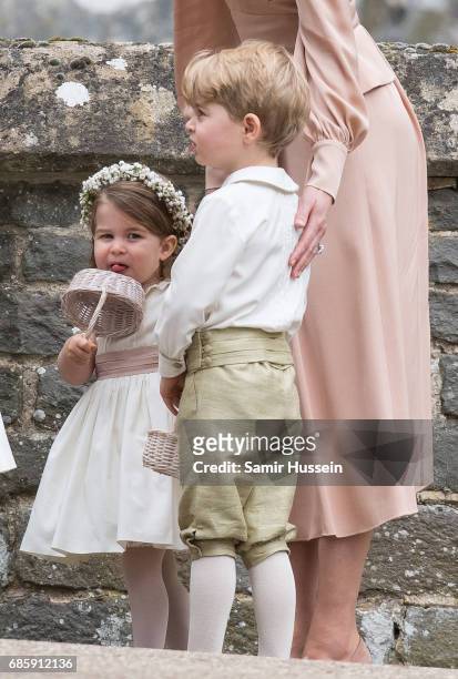 Princess Charlotte of Cambridge bridesmaid and Prince George of Cambridge attend the wedding Of Pippa Middleton and James Matthews at St Mark's...