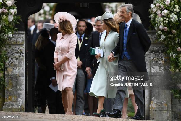 Carole Middleton , and her husband Michael Middleton leave St Mark's Church in Englefield, west of London, on May 20 after attending the wedding of...