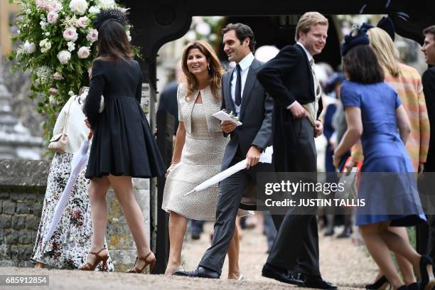 Swiss tennis player Roger Federer and his wife Mirka loeave the wedding of Pippa Middleton to James Matthews at St Mark's Church in Englefield, west...