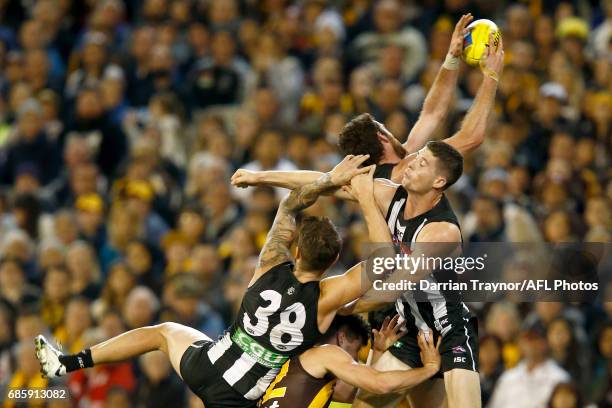 Tyson Goldsack of the Magpies attempts to mark the ball during the round nine AFL match between the Collingwood Magpies and the Hawthorn Hawks at...