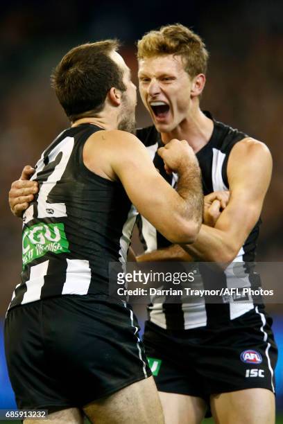 Steele Sidebottom of the Magpies celebrates a goal with team mate Will Hoskin-Elliott during the round nine AFL match between the Collingwood Magpies...