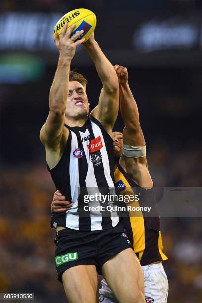 Darcy Moore of the Magpies marks infront of Josh Gibson of the Hawks during the round nine AFL match between the Collingwood Magpies and the Hawthorn...