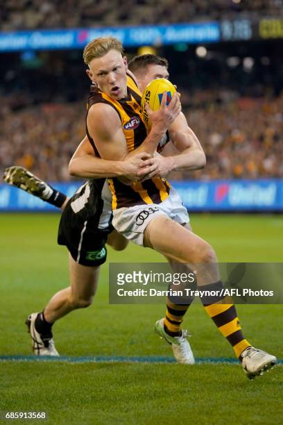 James Sicily of the Hawks is tackled during the round nine AFL match between the Collingwood Magpies and the Hawthorn Hawks at Melbourne Cricket...