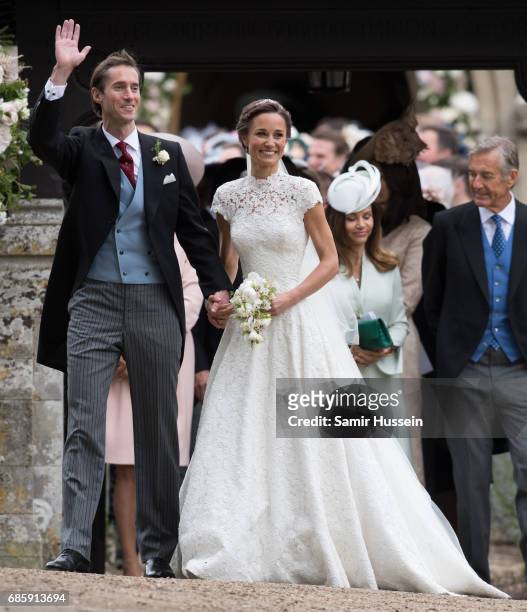 Pippa Middleton and James Matthews leave after getting married at the wedding Of Pippa Middleton and James Matthews at St Mark's Church on May 20,...