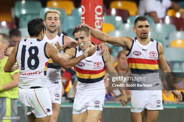 Jordan Gallucci of the Crows celebrates with Eddie Betts of the Crows, Rory Atkins of the Crows after kicking a goal during the round nine AFL match...