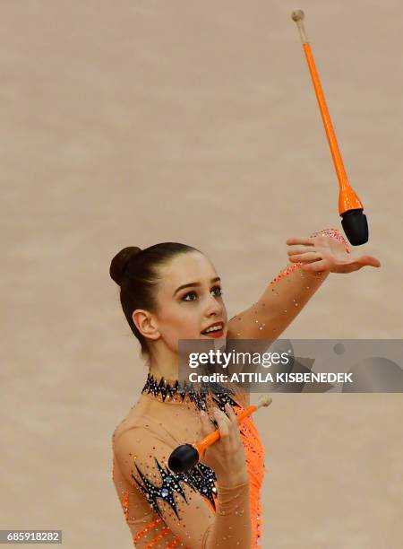 Lithuania's Neringa Masionyte performs with her clubs during the 33rd Rhythmic Gymnastics European championships in Budapest, Hungary on May 20,...