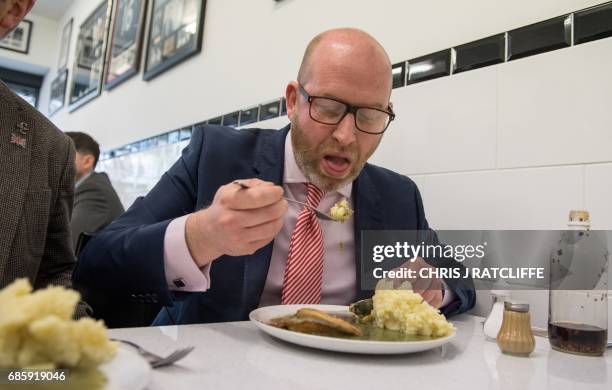 Independence Party leader Paul Nuttall eats pie and mash in a cafe, as he campaigns with local candidate Peter Harris , in Dagenham, east London, on...