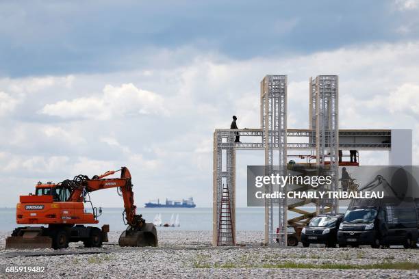 People construct an art installation dedicated to the 500th anniversary of the city of Le Havre on May 20, 2017 in Le Havre, northwestern France. /...