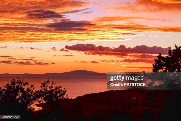 sunset over adriatic sea - novalja stock-fotos und bilder