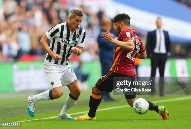 Steve Morison of Millwall beats Nat Knight-Percival of Bradford City during the Sky Bet League One Playoff Final between Bradford City and Millwall...