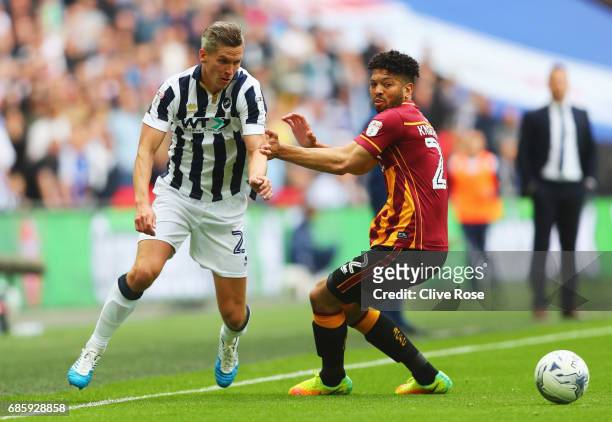 Steve Morison of Millwall beats Nat Knight-Percival of Bradford City during the Sky Bet League One Playoff Final between Bradford City and Millwall...