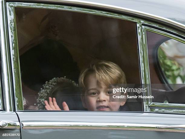 Pageboy Prince George of Cambridge waves as he leaves by car the wedding Of Pippa Middleton and James Matthews at St Mark's Church on May 20, 2017 in...