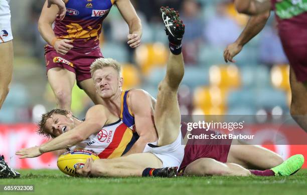 Rory Sloane of the Crows is tackled during the round nine AFL match between the Brisbane Lions and the Adelaide Crows at The Gabba on May 20, 2017 in...