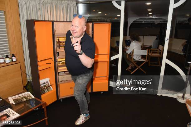 Trunk designer Fred Pinel from Pinel and pinel pose with his work during the Technikart Boat Party during 70th annual Cannes Film Festival at Palais...