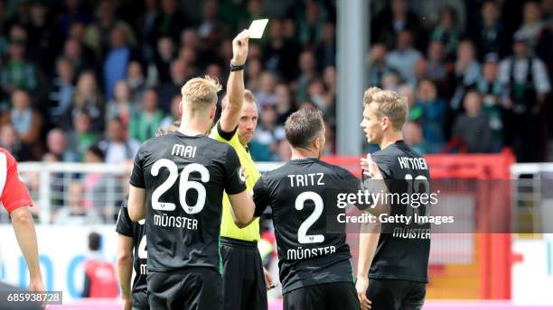 Stephane Tritz of Preussen Muenster yellow-card during the German third league match between Preussen Muenster and Jahn Regensburg on May 20, 2017 in...