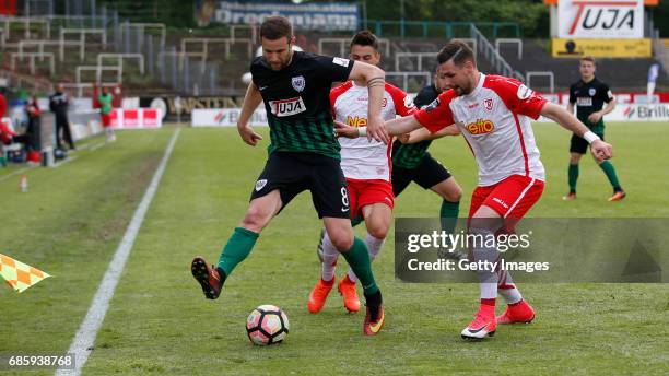 Michele Rizzi of Preussen Muenster in duel with Patrick Lienhard Jahn Regensburg during the German third league match between Preussen Muenster and...