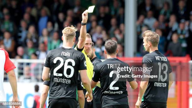 Stephane Tritz of Preussen Muenster yellow-card during the German third league match between Preussen Muenster and Jahn Regensburg on May 20, 2017 in...