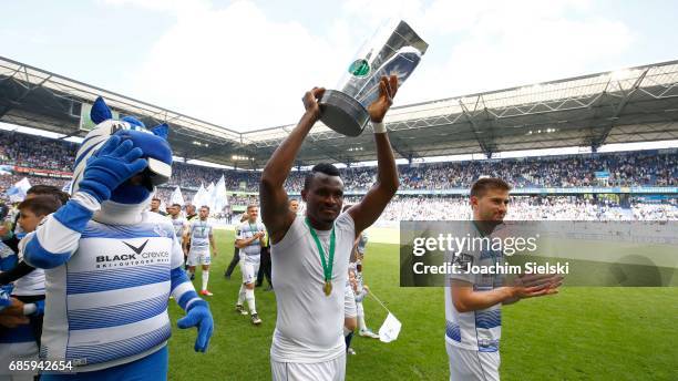 Kingsley Onuegbu of Duisburg celebrate winning the Championship after the third league match between MSV Duisburg and FSV Zwickau at schauinsland...