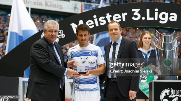 Fabian Schnellhardt of Duisburg and Peter Frymuth and Markus Stenger after the third league match between MSV Duisburg and FSV Zwickau at...