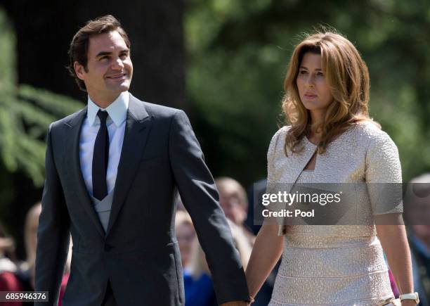 Roger Federer and Mirka Federer attend the wedding of Pippa Middleton and James Matthews at St Mark's Church on May 20, 2017 in Englefield Green,...