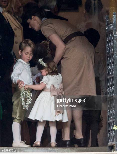 Nanny Maria Teresa Borrallo with Prince George of Cambridge and Princess Charlotte of Cambridge attend the wedding of Pippa Middleton and James...