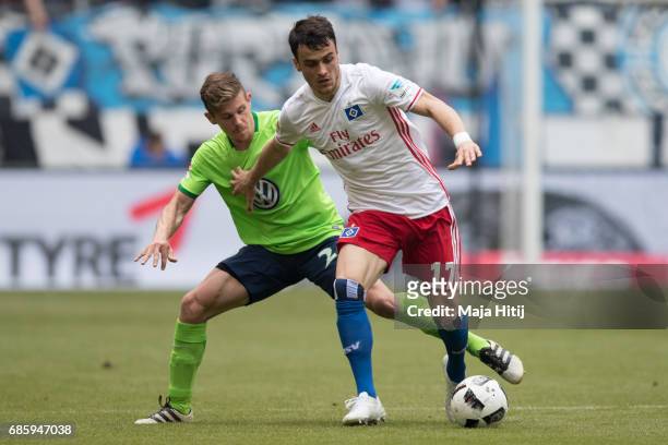 Filip Kostic of Hamburg and Sebastian Jung of Wolfsburg battle for the ball during the Bundesliga match between Hamburger SV and VfL Wolfsburg at...