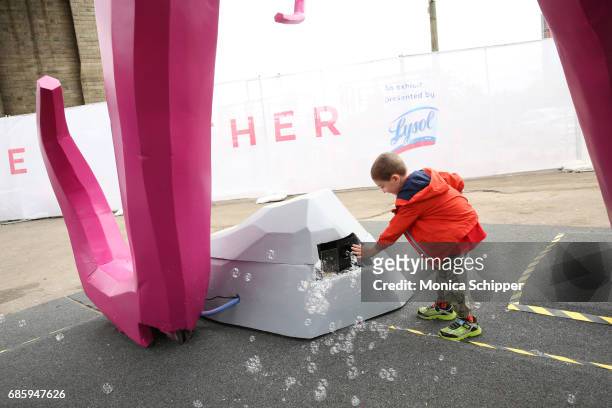 Guests attend the Family-Friendly 'Protect Like A Mother' Interactive Exhibit sponsored by Lysol at Brooklyn Bridge Park on May 20, 2017 in Brooklyn,...