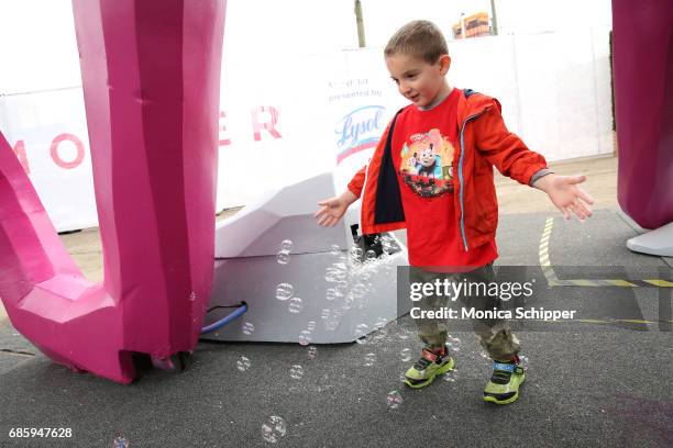 Guests attend the Family-Friendly 'Protect Like A Mother' Interactive Exhibit sponsored by Lysol at Brooklyn Bridge Park on May 20, 2017 in Brooklyn,...