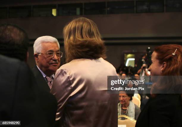 Israeli politician and former foreign minister of Israel Tzipi Livni is greeted by Palestinian President Mahmud Abbas during the opening session of...