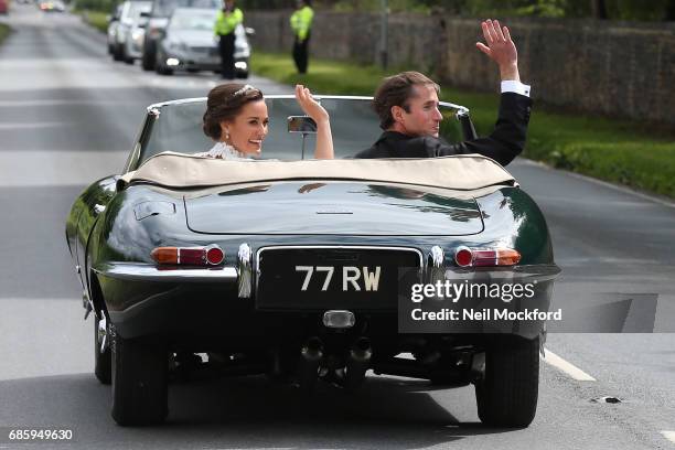 Bride Pippa Middleton and her new husband James Matthews seen leaving St Mark's Church in a classic car after their Wedding Ceremony on May 20, 2017...