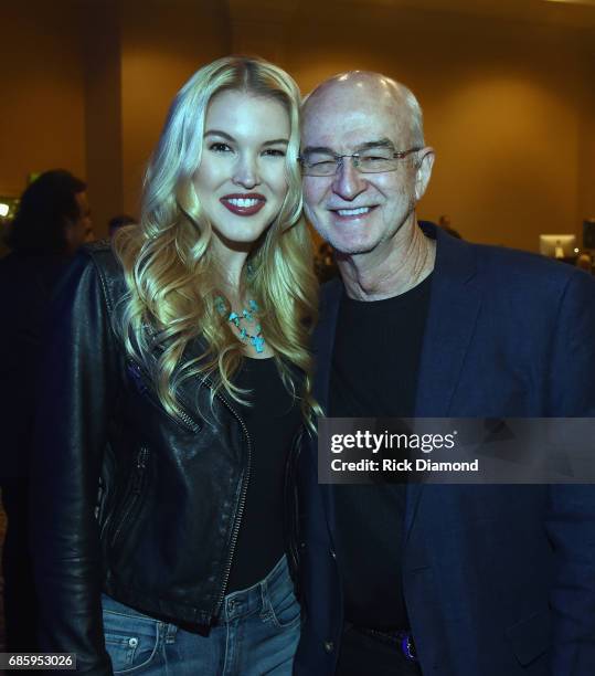 Singer/Songwriter Ashley Campbell with Carl Jackson. Glens banjo player/Producer of Glen's recent album Adios backstage during Music Biz 2017 -...