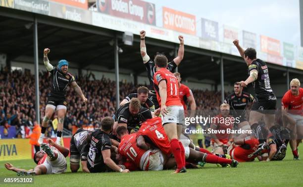 Exeter players celebrate as Sam Simmonds of Exeter Chiefs scores the late match winning try during the Aviva Premiership semi final match between...