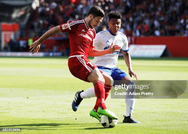 Matthew Leckie of Ingolstadt 04 is challenged by Weston McKennie of Schalke 04 during the Bundesliga match between FC Ingolstadt 04 and FC Schalke 04...