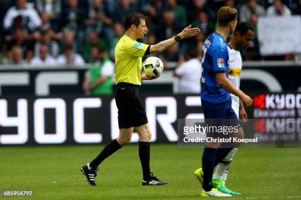 Referee Wolfgang Stark pipes off his last match during the Bundesliga match between Borussia Moenchengladbach and SV Darmstadt 98 at Borussia-Park on...