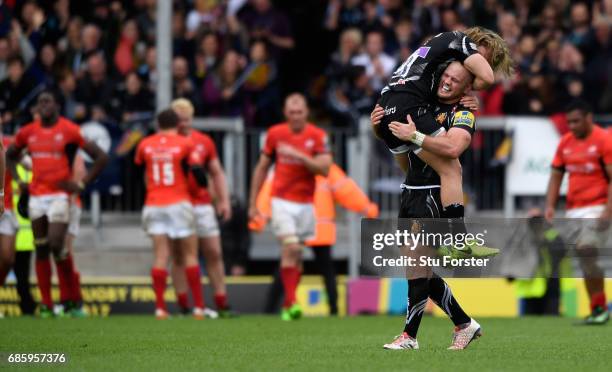 Chiefs player Jack Yeandle and Michele Campagnaro celebrate the last minute winning try during the Aviva Premiership match between Exeter Chiefs and...