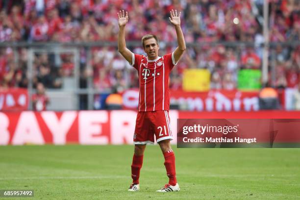 Philipp Lahm of Bayern Muenchen waves to the fans as he leaves the pitch during the Bundesliga match between Bayern Muenchen and SC Freiburg at...
