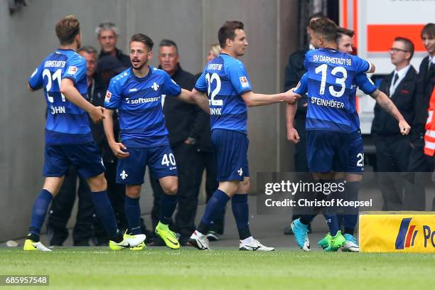 Marcel Heller of Darmstadt celebrates the second goal with his team mates during the Bundesliga match between Borussia Moenchengladbach and SV...