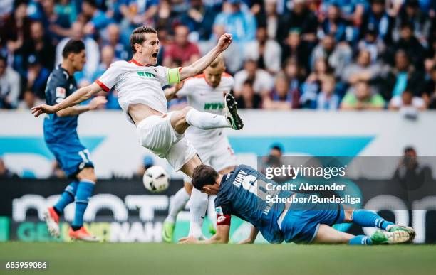 Sebastian Rudy of Hoffenheim challenges Paul Verhaegh of Augsburg during the Bundesliga match between TSG 1899 Hoffenheim and FC Augsburg at Wirsol...