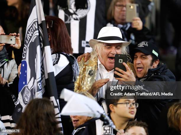 Magpies fan Joffa celebrates with a friend during the 2017 AFL round 09 match between the Collingwood Magpies and the Hawthorn Hawks at the Melbourne...